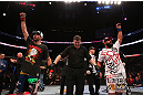 MONTREAL, QC - MARCH 16:  Johny Hendricks (R) and Carlos Condit (L) react as the judges' scores are read after their welterweight bout during the UFC 158 event at Bell Centre on March 16, 2013 in Montreal, Quebec, Canada.  (Photo by Jonathan Ferrey/Zuffa LLC/Zuffa LLC via Getty Images)