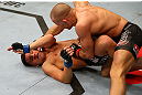 MONTREAL, QC - MARCH 16: Georges St-Pierre controls Nick Diaz on the ground in their welterweight championship bout during the UFC 158 event at Bell Centre on March 16, 2013 in Montreal, Quebec, Canada.  (Photo by Jonathan Ferrey/Zuffa LLC/Zuffa LLC via Getty Images)