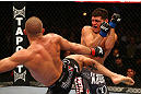 MONTREAL, QC - MARCH 16:  (R-L) Georges St-Pierre lands a kick against Nick Diaz in their welterweight championship bout during the UFC 158 event at Bell Centre on March 16, 2013 in Montreal, Quebec, Canada.  (Photo by Jonathan Ferrey/Zuffa LLC/Zuffa LLC via Getty Images)