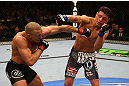 MONTREAL, QC - MARCH 16:  (L-R) Georges St-Pierre trades punches with Nick Diaz in their welterweight championship bout during the UFC 158 event at Bell Centre on March 16, 2013 in Montreal, Quebec, Canada.  (Photo by Jonathan Ferrey/Zuffa LLC/Zuffa LLC via Getty Images)