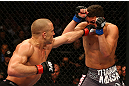 MONTREAL, QC - MARCH 16:  (L-R) Georges St-Pierre lands a punch against Nick Diaz in their welterweight championship bout during the UFC 158 event at Bell Centre on March 16, 2013 in Montreal, Quebec, Canada.  (Photo by Jonathan Ferrey/Zuffa LLC/Zuffa LLC via Getty Images)