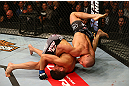 MONTREAL, QC - MARCH 16: (L-R) Georges St-Pierre flips Nick Diaz during their welterweight championship bout during the UFC 158 event at Bell Centre on March 16, 2013 in Montreal, Quebec, Canada.  (Photo by Jonathan Ferrey/Zuffa LLC/Zuffa LLC via Getty Images)