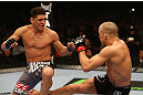 MONTREAL, QC - MARCH 16:  (R-L) Georges St-Pierre lands a kick against Nick Diaz in their welterweight championship bout during the UFC 158 event at Bell Centre on March 16, 2013 in Montreal, Quebec, Canada.  (Photo by Jonathan Ferrey/Zuffa LLC/Zuffa LLC via Getty Images)
