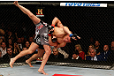 MONTREAL, QC - MARCH 16:  (L-R) Georges St-Pierre takes down Nick Diaz in their welterweight championship bout during the UFC 158 event at Bell Centre on March 16, 2013 in Montreal, Quebec, Canada.  (Photo by Josh Hedges/Zuffa LLC/Zuffa LLC via Getty Images)