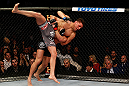 MONTREAL, QC - MARCH 16:  (L-R) Georges St-Pierre takes down Nick Diaz in their welterweight championship bout during the UFC 158 event at Bell Centre on March 16, 2013 in Montreal, Quebec, Canada.  (Photo by Josh Hedges/Zuffa LLC/Zuffa LLC via Getty Images)