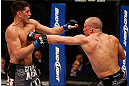 MONTREAL, QC - MARCH 16:  (R-L) Georges St-Pierre punches Nick Diaz in their welterweight championship bout during the UFC 158 event at Bell Centre on March 16, 2013 in Montreal, Quebec, Canada.  (Photo by Josh Hedges/Zuffa LLC/Zuffa LLC via Getty Images)