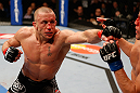 MONTREAL, QC - MARCH 16:  (L-R) Georges St-Pierre punches Nick Diaz in their welterweight championship bout during the UFC 158 event at Bell Centre on March 16, 2013 in Montreal, Quebec, Canada.  (Photo by Josh Hedges/Zuffa LLC/Zuffa LLC via Getty Images)