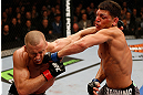 MONTREAL, QC - MARCH 16:  (R-L) Nick Diaz punches Georges St-Pierre in their welterweight championship bout during the UFC 158 event at Bell Centre on March 16, 2013 in Montreal, Quebec, Canada.  (Photo by Josh Hedges/Zuffa LLC/Zuffa LLC via Getty Images)