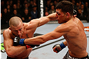 MONTREAL, QC - MARCH 16:  (R-L) Nick Diaz punches Georges St-Pierre in their welterweight championship bout during the UFC 158 event at Bell Centre on March 16, 2013 in Montreal, Quebec, Canada.  (Photo by Josh Hedges/Zuffa LLC/Zuffa LLC via Getty Images)