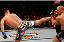 MONTREAL, QC - MARCH 16:  (L-R) Nick Diaz kicks Georges St-Pierre in their welterweight championship bout during the UFC 158 event at Bell Centre on March 16, 2013 in Montreal, Quebec, Canada.  (Photo by Josh Hedges/Zuffa LLC/Zuffa LLC via Getty Images)
