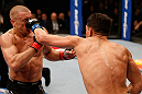 MONTREAL, QC - MARCH 16:  (R-L) Nick Diaz punches Georges St-Pierre in their welterweight championship bout during the UFC 158 event at Bell Centre on March 16, 2013 in Montreal, Quebec, Canada.  (Photo by Josh Hedges/Zuffa LLC/Zuffa LLC via Getty Images)