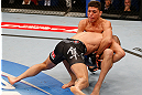 MONTREAL, QC - MARCH 16:  (L-R) Georges St-Pierre takes down Nick Diaz in their welterweight championship bout during the UFC 158 event at Bell Centre on March 16, 2013 in Montreal, Quebec, Canada.  (Photo by Josh Hedges/Zuffa LLC/Zuffa LLC via Getty Images)