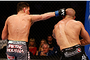 MONTREAL, QC - MARCH 16:  (L-R) Nick Diaz punches Georges St-Pierre in their welterweight championship bout during the UFC 158 event at Bell Centre on March 16, 2013 in Montreal, Quebec, Canada.  (Photo by Josh Hedges/Zuffa LLC/Zuffa LLC via Getty Images)