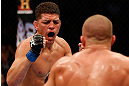 MONTREAL, QC - MARCH 16:  (L-R) Nick Diaz taunts Georges St-Pierre in their welterweight championship bout during the UFC 158 event at Bell Centre on March 16, 2013 in Montreal, Quebec, Canada.  (Photo by Josh Hedges/Zuffa LLC/Zuffa LLC via Getty Images)