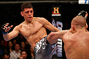 MONTREAL, QC - MARCH 16:  (L-R) Nick Diaz kicks Georges St-Pierre in their welterweight championship bout during the UFC 158 event at Bell Centre on March 16, 2013 in Montreal, Quebec, Canada.  (Photo by Josh Hedges/Zuffa LLC/Zuffa LLC via Getty Images)