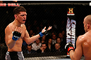 MONTREAL, QC - MARCH 16:  (L-R) Nick Diaz taunts Georges St-Pierre in their welterweight championship bout during the UFC 158 event at Bell Centre on March 16, 2013 in Montreal, Quebec, Canada.  (Photo by Josh Hedges/Zuffa LLC/Zuffa LLC via Getty Images)