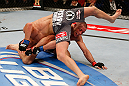 MONTREAL, QC - MARCH 16:  (L-R) Nick Diaz attempts to escape from bottom position against Georges St-Pierre in their welterweight championship bout during the UFC 158 event at Bell Centre on March 16, 2013 in Montreal, Quebec, Canada.  (Photo by Josh Hedges/Zuffa LLC/Zuffa LLC via Getty Images)