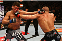 MONTREAL, QC - MARCH 16:  (R-L) Georges St-Pierre punches Nick Diaz in their welterweight championship bout during the UFC 158 event at Bell Centre on March 16, 2013 in Montreal, Quebec, Canada.  (Photo by Jonathan Ferrey/Zuffa LLC/Zuffa LLC via Getty Images)