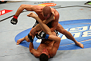MONTREAL, QC - MARCH 16:  Georges St-Pierre (top) punches Nick Diaz in their welterweight championship bout during the UFC 158 event at Bell Centre on March 16, 2013 in Montreal, Quebec, Canada.  (Photo by Jonathan Ferrey/Zuffa LLC/Zuffa LLC via Getty Images)