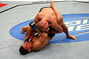 MONTREAL, QC - MARCH 16:  (L-R) Nick Diaz attempts a submission against Georges St-Pierre in their welterweight championship bout during the UFC 158 event at Bell Centre on March 16, 2013 in Montreal, Quebec, Canada.  (Photo by Jonathan Ferrey/Zuffa LLC/Zuffa LLC via Getty Images)