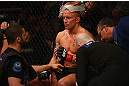 MONTREAL, QC - MARCH 16:  Georges St-Pierre sits in his corner between rounds of his welterweight championship bout against Nick Diaz during the UFC 158 event at Bell Centre on March 16, 2013 in Montreal, Quebec, Canada.  (Photo by Jonathan Ferrey/Zuffa LLC/Zuffa LLC via Getty Images)
