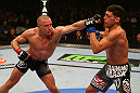 MONTREAL, QC - MARCH 16:  (L-R) Georges St-Pierre punches Nick Diaz in their welterweight championship bout during the UFC 158 event at Bell Centre on March 16, 2013 in Montreal, Quebec, Canada.  (Photo by Jonathan Ferrey/Zuffa LLC/Zuffa LLC via Getty Images)