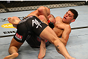MONTREAL, QC - MARCH 16:  (R-L) Nick Diaz and Georges St-Pierre grapple in their welterweight championship bout during the UFC 158 event at Bell Centre on March 16, 2013 in Montreal, Quebec, Canada.  (Photo by Jonathan Ferrey/Zuffa LLC/Zuffa LLC via Getty Images)