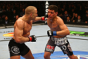 MONTREAL, QC - MARCH 16:  (L-R) Georges St-Pierre punches Nick Diaz in their welterweight championship bout during the UFC 158 event at Bell Centre on March 16, 2013 in Montreal, Quebec, Canada.  (Photo by Jonathan Ferrey/Zuffa LLC/Zuffa LLC via Getty Images)