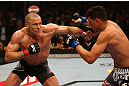 MONTREAL, QC - MARCH 16:  (L-R) Georges St-Pierre punches Nick Diaz in their welterweight championship bout during the UFC 158 event at Bell Centre on March 16, 2013 in Montreal, Quebec, Canada.  (Photo by Jonathan Ferrey/Zuffa LLC/Zuffa LLC via Getty Images)