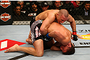 MONTREAL, QC - MARCH 16:  Georges St-Pierre (top) punches Nick Diaz in their welterweight championship bout during the UFC 158 event at Bell Centre on March 16, 2013 in Montreal, Quebec, Canada.  (Photo by Jonathan Ferrey/Zuffa LLC/Zuffa LLC via Getty Images)