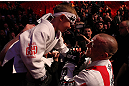 MONTREAL, QC - MARCH 16:  Georges St-Pierre greets a young fan on his way out of the arena after his victory over Nick Diaz in their welterweight championship bout during the UFC 158 event at Bell Centre on March 16, 2013 in Montreal, Quebec, Canada.  (Photo by Jonathan Ferrey/Zuffa LLC/Zuffa LLC via Getty Images)