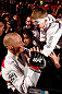 MONTREAL, QC - MARCH 16:  Georges St-Pierre greets a young fan on his way out of the arena after his victory over Nick Diaz in their welterweight championship bout during the UFC 158 event at Bell Centre on March 16, 2013 in Montreal, Quebec, Canada.  (Photo by Josh Hedges/Zuffa LLC/Zuffa LLC via Getty Images)