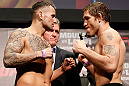 STOCKHOLM, SWEDEN - APRIL 05:  (L-R) Opponents Michael Kuiper and Tom Lawlor face off during the UFC weigh-in at the Ericsson Globe Arena on April 5, 2013 in Stockholm, Sweden.  (Photo by Josh Hedges/Zuffa LLC/Zuffa LLC via Getty Images)