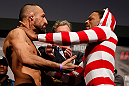 STOCKHOLM, SWEDEN - APRIL 05:  (L-R) Opponents Reza Madadi and Michael Johnson face off during the UFC weigh-in at the Ericsson Globe Arena on April 5, 2013 in Stockholm, Sweden.  (Photo by Josh Hedges/Zuffa LLC/Zuffa LLC via Getty Images)