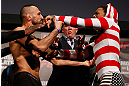 STOCKHOLM, SWEDEN - APRIL 05:  (L-R) Opponents Reza Madadi and Michael Johnson face off during the UFC weigh-in at the Ericsson Globe Arena on April 5, 2013 in Stockholm, Sweden.  (Photo by Josh Hedges/Zuffa LLC/Zuffa LLC via Getty Images)
