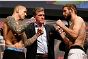 STOCKHOLM, SWEDEN - APRIL 05:  (L-R) Opponents Ross Pearson and Ryan Couture face off during the UFC weigh-in at the Ericsson Globe Arena on April 5, 2013 in Stockholm, Sweden.  (Photo by Josh Hedges/Zuffa LLC/Zuffa LLC via Getty Images)