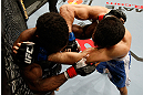 STOCKHOLM, SWEDEN - APRIL 06:  (R-L) Besam Yousef punches Papy Abedi in their welterweight fight at the Ericsson Globe Arena on April 6, 2013 in Stockholm, Sweden.  (Photo by Josh Hedges/Zuffa LLC/Zuffa LLC via Getty Images)