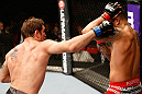 STOCKHOLM, SWEDEN - APRIL 06:  (L-R) Tom Lawlor punches Michael Kuiper in their middleweight fight at the Ericsson Globe Arena on April 6, 2013 in Stockholm, Sweden.  (Photo by Josh Hedges/Zuffa LLC/Zuffa LLC via Getty Images)