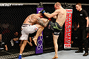 STOCKHOLM, SWEDEN - APRIL 06:  (R-L) Ryan LaFlare knees Benny Alloway in their welterweight fight at the Ericsson Globe Arena on April 6, 2013 in Stockholm, Sweden.  (Photo by Josh Hedges/Zuffa LLC/Zuffa LLC via Getty Images)