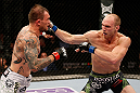 STOCKHOLM, SWEDEN - APRIL 06:  (R-L) Ryan LaFlare punches Benny Alloway in their welterweight fight at the Ericsson Globe Arena on April 6, 2013 in Stockholm, Sweden.  (Photo by Josh Hedges/Zuffa LLC/Zuffa LLC via Getty Images)