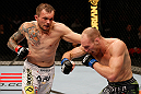STOCKHOLM, SWEDEN - APRIL 06:  (L-R) Benny Alloway punches Ryan LaFlare in their welterweight fight at the Ericsson Globe Arena on April 6, 2013 in Stockholm, Sweden.  (Photo by Josh Hedges/Zuffa LLC/Zuffa LLC via Getty Images)