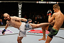 STOCKHOLM, SWEDEN - APRIL 06:  (L-R) Adlan Amagov kicks Chris Spang in their welterweight fight at the Ericsson Globe Arena on April 6, 2013 in Stockholm, Sweden.  (Photo by Josh Hedges/Zuffa LLC/Zuffa LLC via Getty Images)