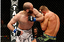 STOCKHOLM, SWEDEN - APRIL 06:  (L-R) Adlan Amagov elbows Chris Spang in their welterweight fight at the Ericsson Globe Arena on April 6, 2013 in Stockholm, Sweden.  (Photo by Josh Hedges/Zuffa LLC/Zuffa LLC via Getty Images)