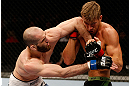 STOCKHOLM, SWEDEN - APRIL 06:  (L-R) Adlan Amagov elbows Chris Spang in their welterweight fight at the Ericsson Globe Arena on April 6, 2013 in Stockholm, Sweden.  (Photo by Josh Hedges/Zuffa LLC/Zuffa LLC via Getty Images)