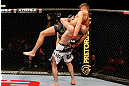 STOCKHOLM, SWEDEN - APRIL 06:  Adlan Amagov (white shorts) takes down Chris Spang in their welterweight fight at the Ericsson Globe Arena on April 6, 2013 in Stockholm, Sweden.  (Photo by Josh Hedges/Zuffa LLC/Zuffa LLC via Getty Images)