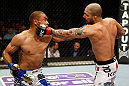 STOCKHOLM, SWEDEN - APRIL 06:  (R-L) Akira Corassani and Robbie Peralta trade punches in their featherweight fight at the Ericsson Globe Arena on April 6, 2013 in Stockholm, Sweden.  (Photo by Josh Hedges/Zuffa LLC/Zuffa LLC via Getty Images)