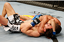 STOCKHOLM, SWEDEN - APRIL 06:  (R-L) Diego Brandao secures an arm triangle choke submission against Pablo Garza in their featherweight fight at the Ericsson Globe Arena on April 6, 2013 in Stockholm, Sweden.  (Photo by Josh Hedges/Zuffa LLC/Zuffa LLC via Getty Images)
