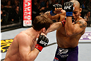 STOCKHOLM, SWEDEN - APRIL 06:  (L-R) Brad Pickett punches Mike Easton in their bantamweight fight at the Ericsson Globe Arena on April 6, 2013 in Stockholm, Sweden.  (Photo by Josh Hedges/Zuffa LLC/Zuffa LLC via Getty Images)
