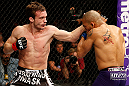 STOCKHOLM, SWEDEN - APRIL 06:  (L-R) Brad Pickett punches Mike Easton in their bantamweight fight at the Ericsson Globe Arena on April 6, 2013 in Stockholm, Sweden.  (Photo by Josh Hedges/Zuffa LLC/Zuffa LLC via Getty Images)