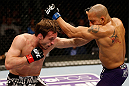 STOCKHOLM, SWEDEN - APRIL 06:  (L-R) Brad Pickett punches Mike Easton in their bantamweight fight at the Ericsson Globe Arena on April 6, 2013 in Stockholm, Sweden.  (Photo by Josh Hedges/Zuffa LLC/Zuffa LLC via Getty Images)